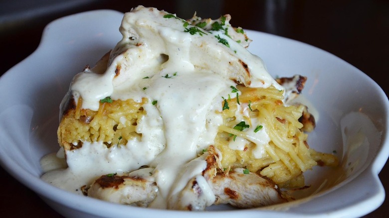 Slice of spaghetti pie with chicken Alfredo