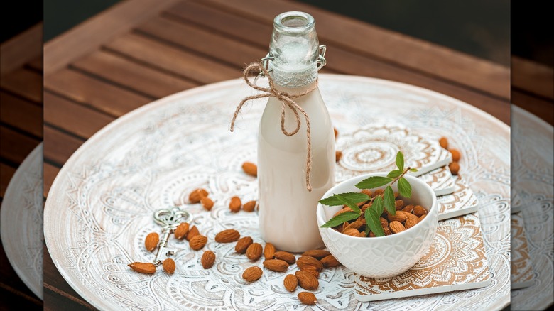 almond milk with bowl of almonds