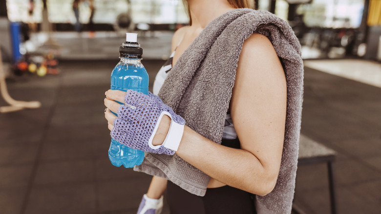 athlete holding sports drink