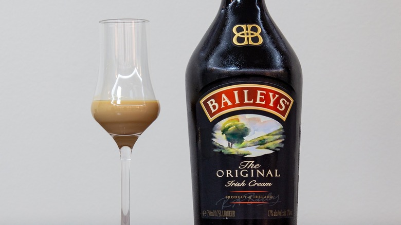 Baileys Irish Cream bottle with glass