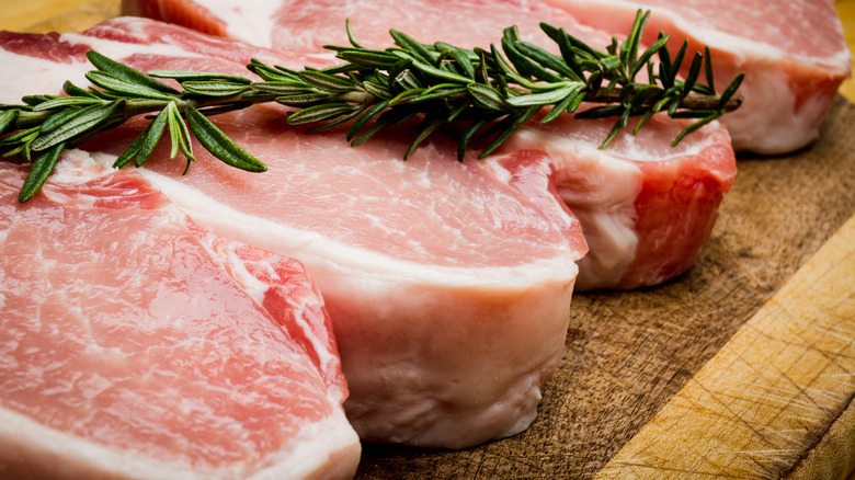 Row of lean pork chops with rosemary