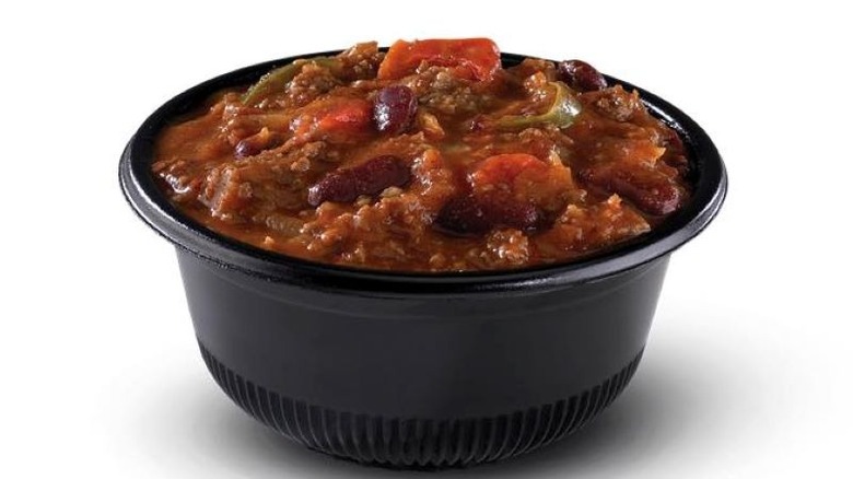 Black bowl of takeout chili