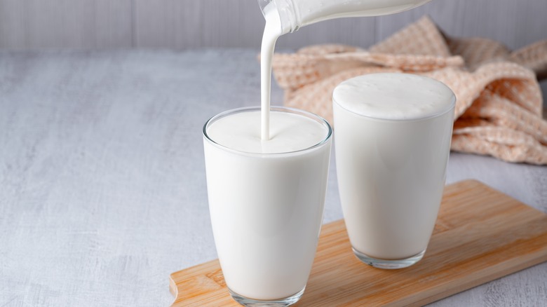 pouring buttermilk into glass