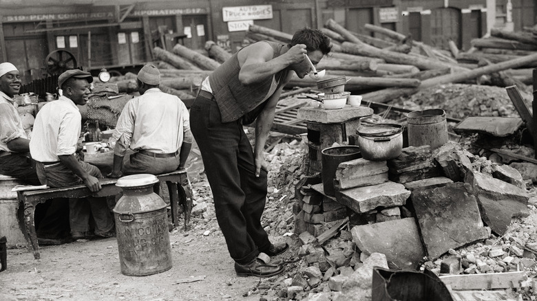 Person trying Mulligan stew