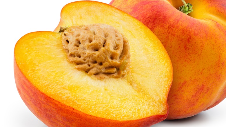 Cut peach with pit