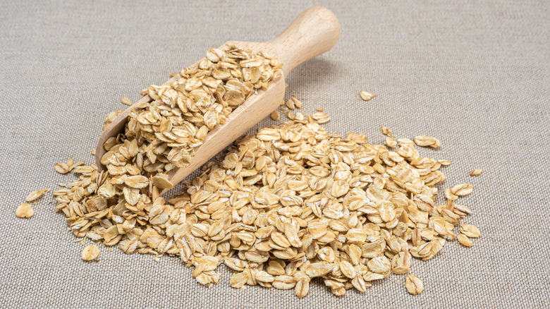 Wooden scoop with oatmeal