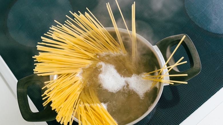 Spaghetti cooking in a pot