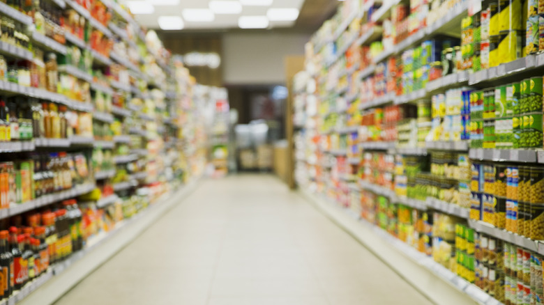 Canned food aisle at grocery store