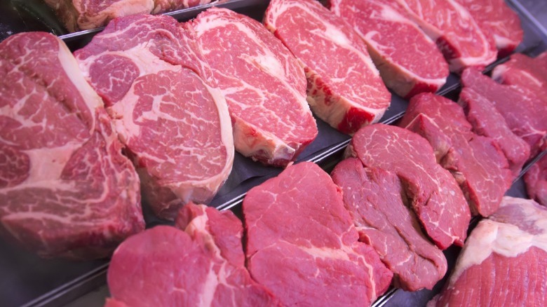 Assorted raw steaks