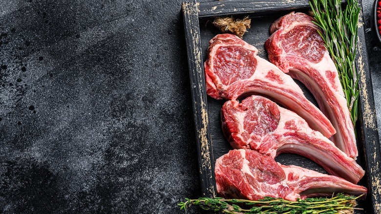 lamb racks in wooden tray