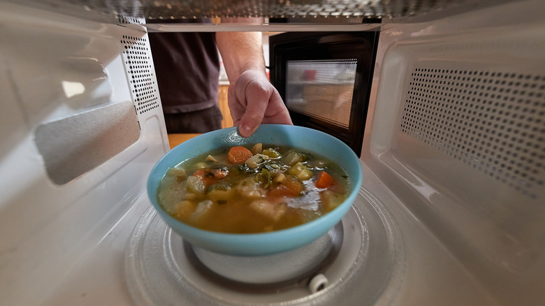 food being placed in microwave