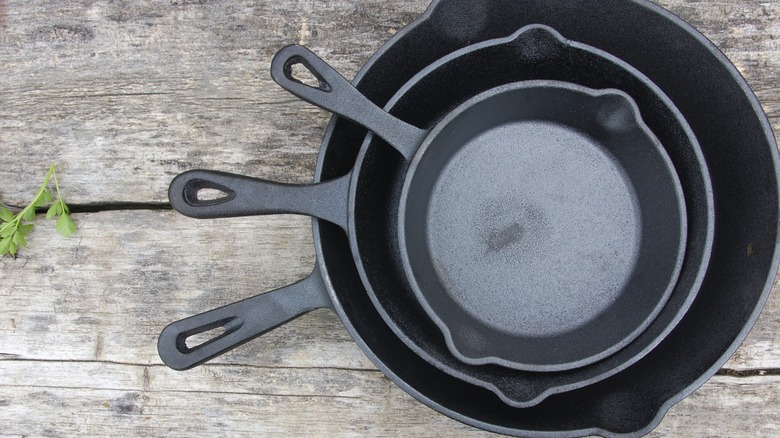 stack of cast iron skillets 