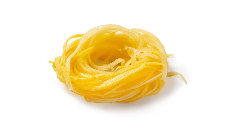 Squash spaghetti on white background