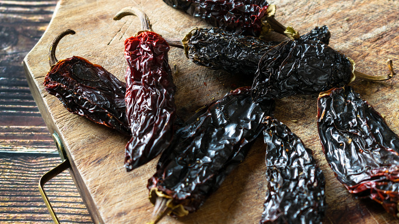 Chipotle peppers on wooden board