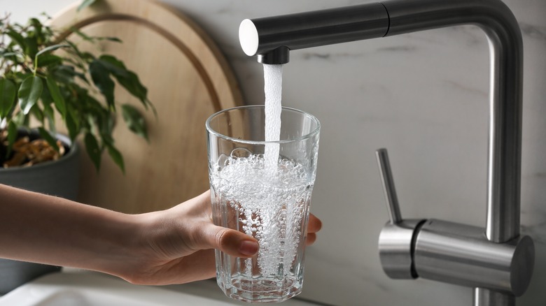 filling glass with tap water