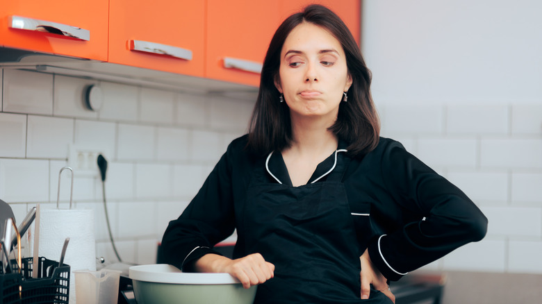 Woman frustrated while cooking