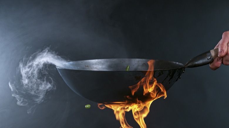wok with flames underneath