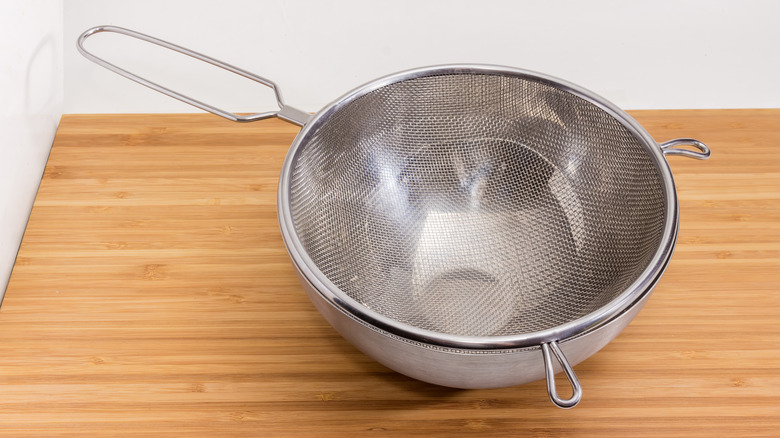 empty strainer and bowl