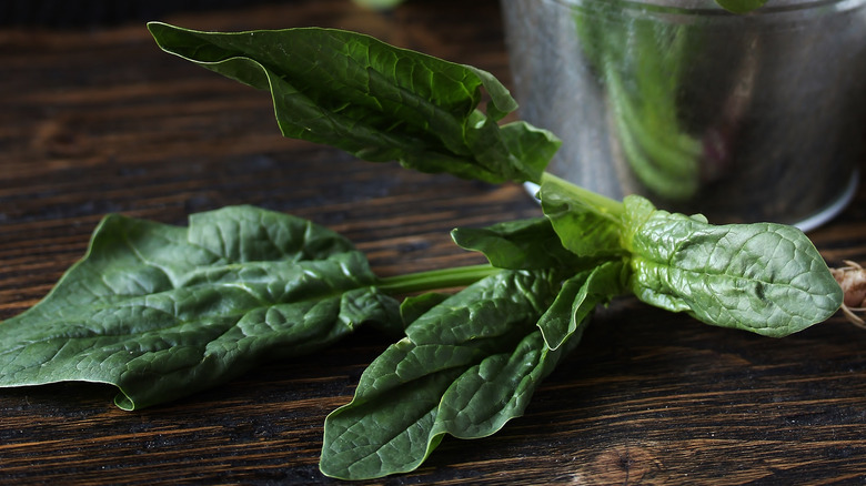 Spinach leaves on table