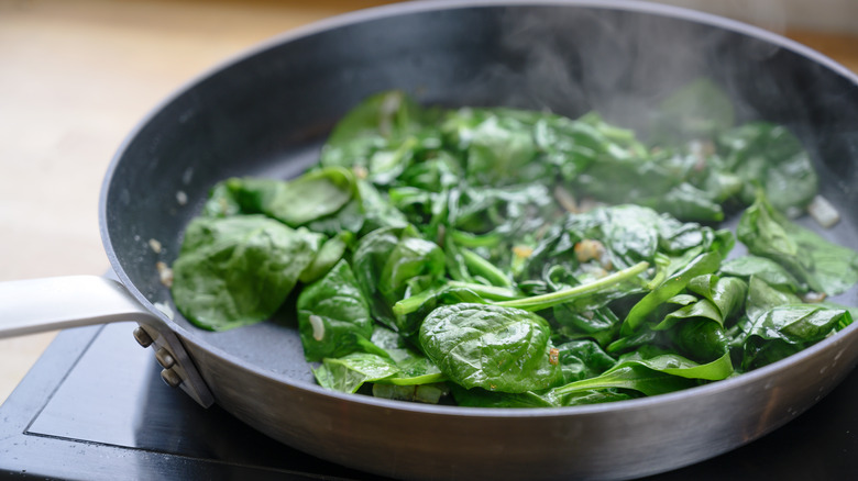 Pan with cooked spinach