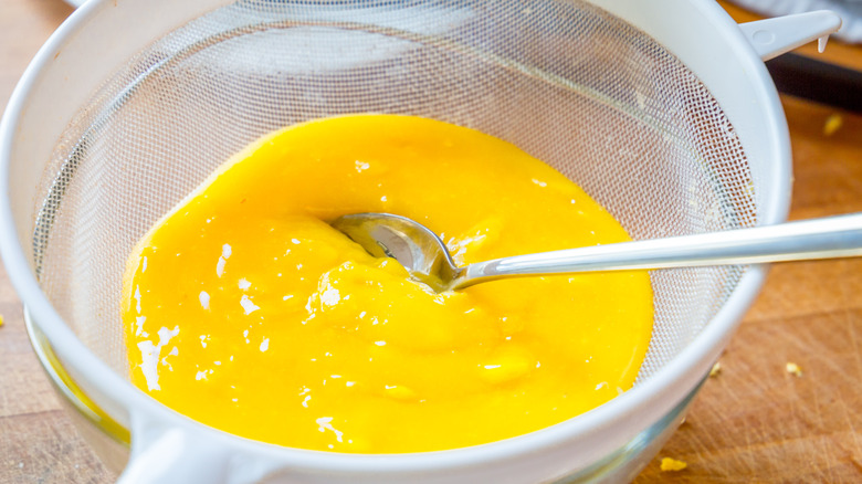 Lemon curd in a sieve