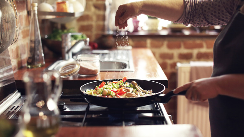 Adding salt to vegetables