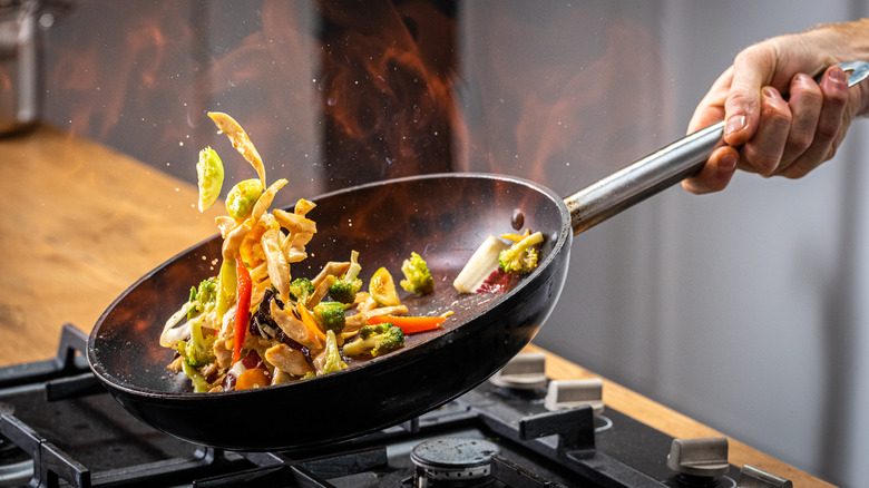 Cooking vegetables in a pan