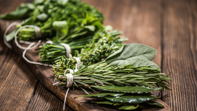 Fresh herbs tied on board