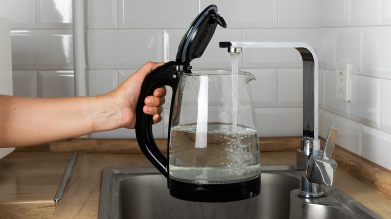 filling kettle with water