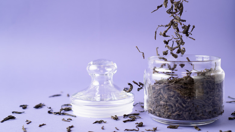 black tea leaves in glass jar