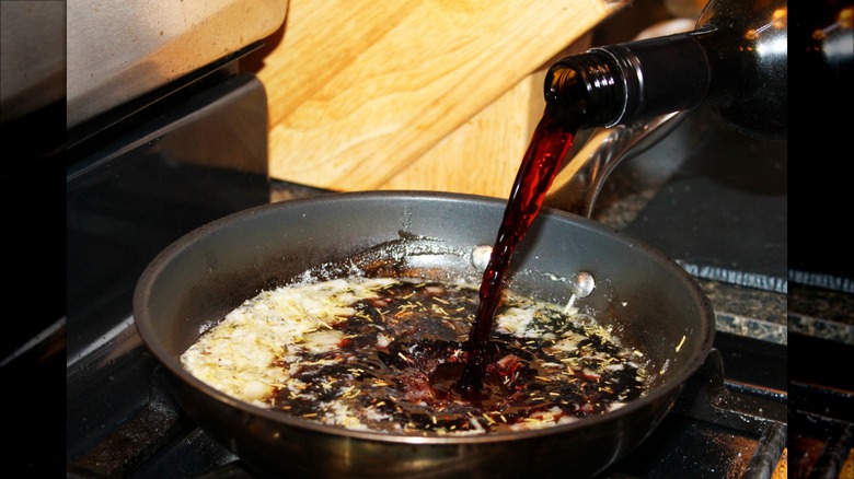 red wine poured into frying pan