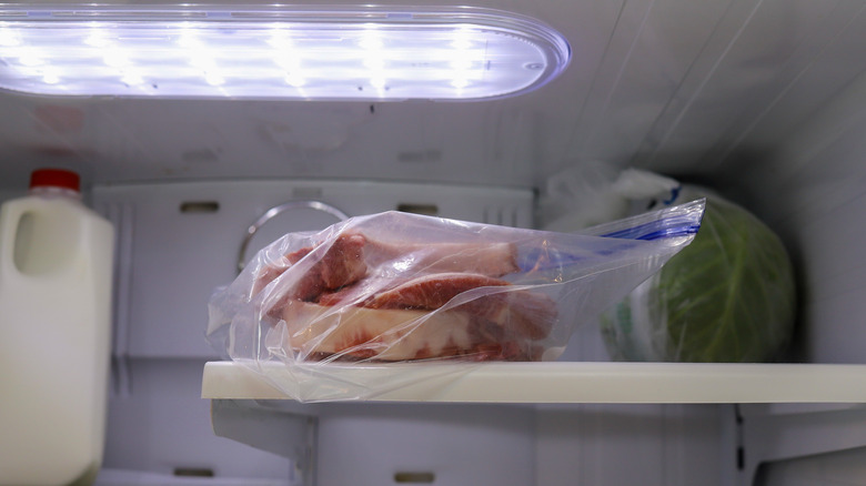 pork chops thawing in fridge