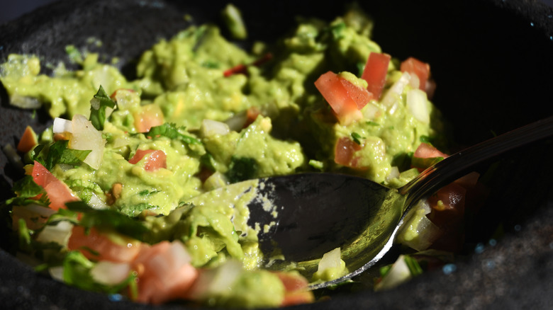 spoon in guacamole