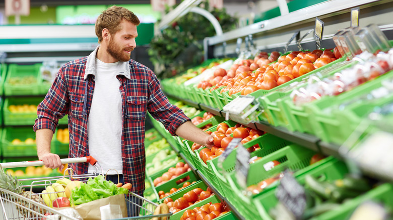 man shopping for produce