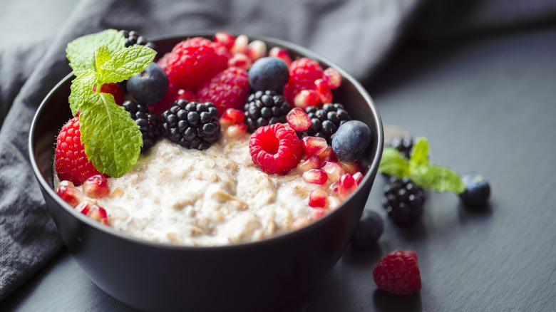 raspberries and blackberries over porridge