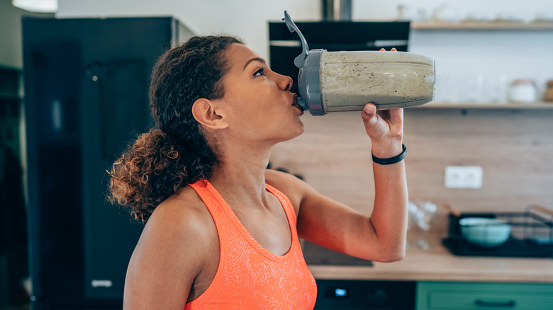 woman drinking protein shake