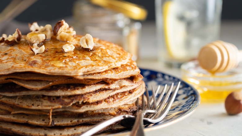 Stack of buckwheat pancakes on plate