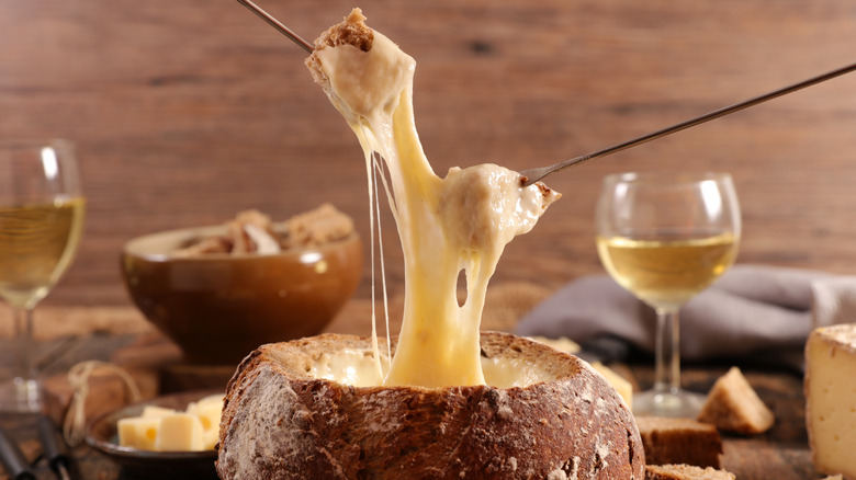 Cheese fondue in bread bowl