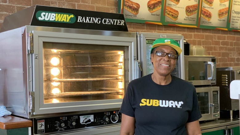 woman beside subway oven