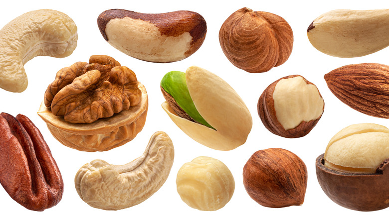 Variety of nuts on white background 