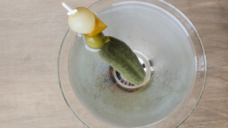 Pickle juice martini on table