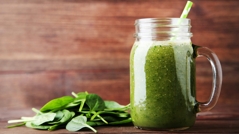 Green spinach drink in cup