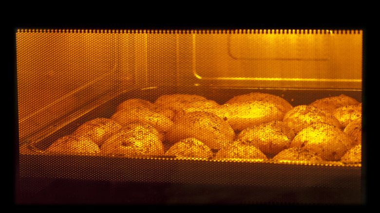 Potatoes baking in an oven