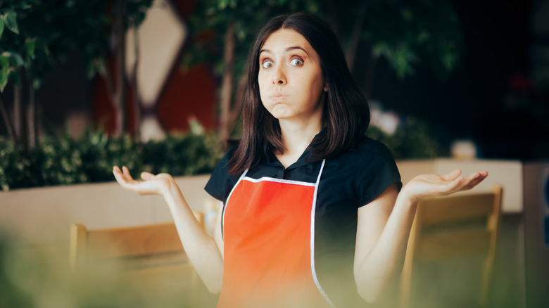 confused woman wearing apron