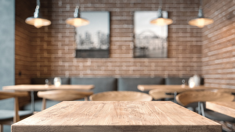 wooden table in empty restaurant