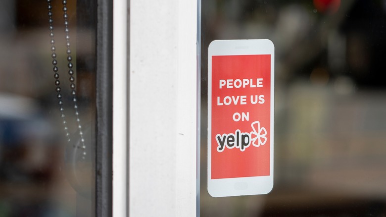 Yelp sticker on window