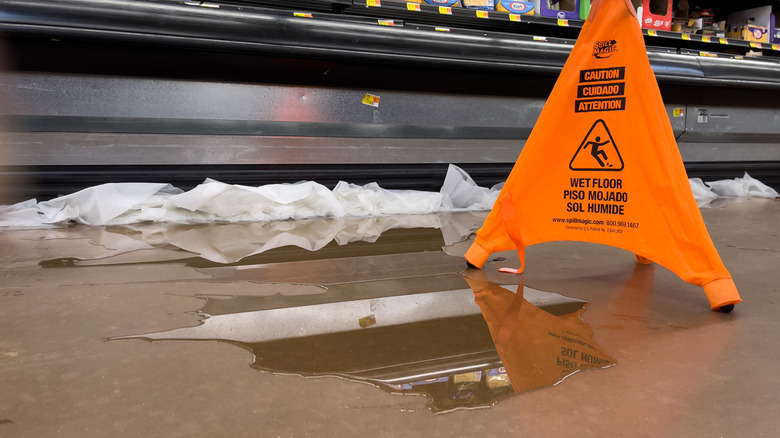 Wet floor with warning sign