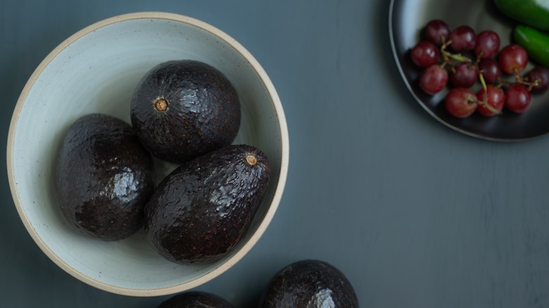 avocados in bowl with grapes