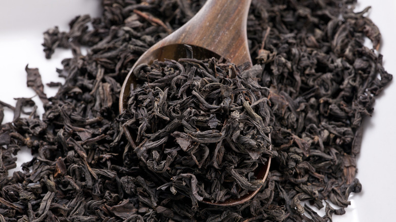 Black tea leaves on spoon