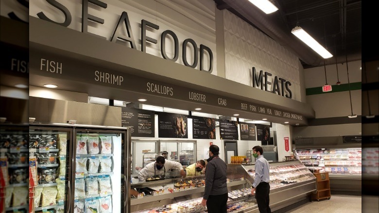 Seafood and meat counter at grocery store